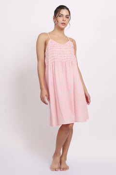 Model wearing Passionflower Frilly Nightie in coral stripe, featuring a square neckline, frill trim, and breezy cotton fit.