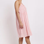 Side profile of Passionflower Nightie, highlighting relaxed drape and coral stripe cotton texture.