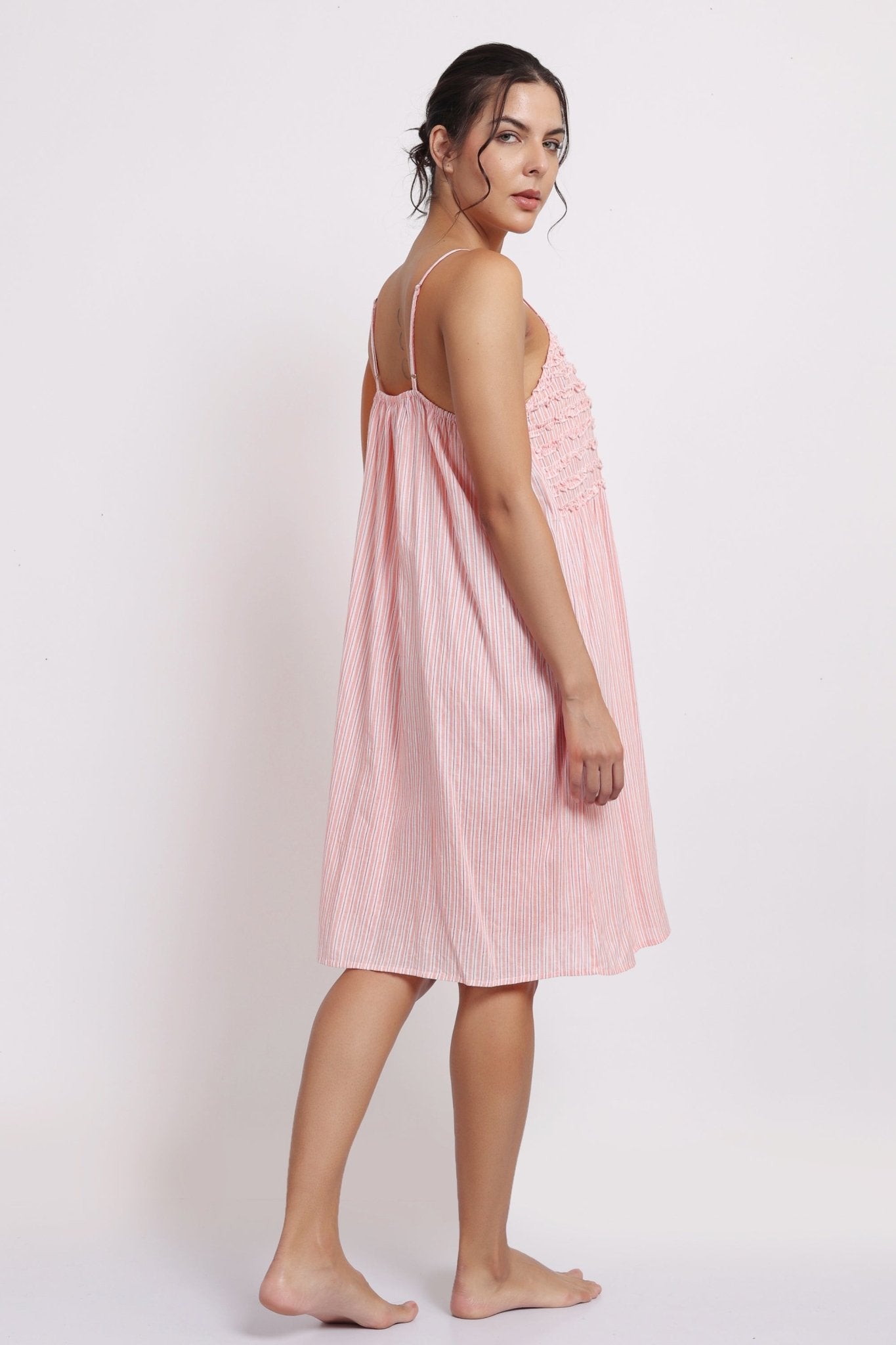 Back view of rilly Nightie in coral stripe, showing adjustable straps and gathered detail at back.