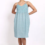 Model wearing Bloom Frilly Nightie in aqua small floral print, a lightweight cotton summer nightdress with frill straps.