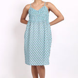 Model wearing Bloom Frilly Nightie in aqua small floral print, a lightweight cotton summer nightdress with frill straps.