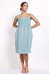 Model wearing Bloom Frilly Nightie in aqua small floral print, a lightweight cotton summer nightdress with frill straps.