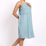 Side view of Bloom cotton nightie in aqua floral print, showing flowy fabric and relaxed summer fit.