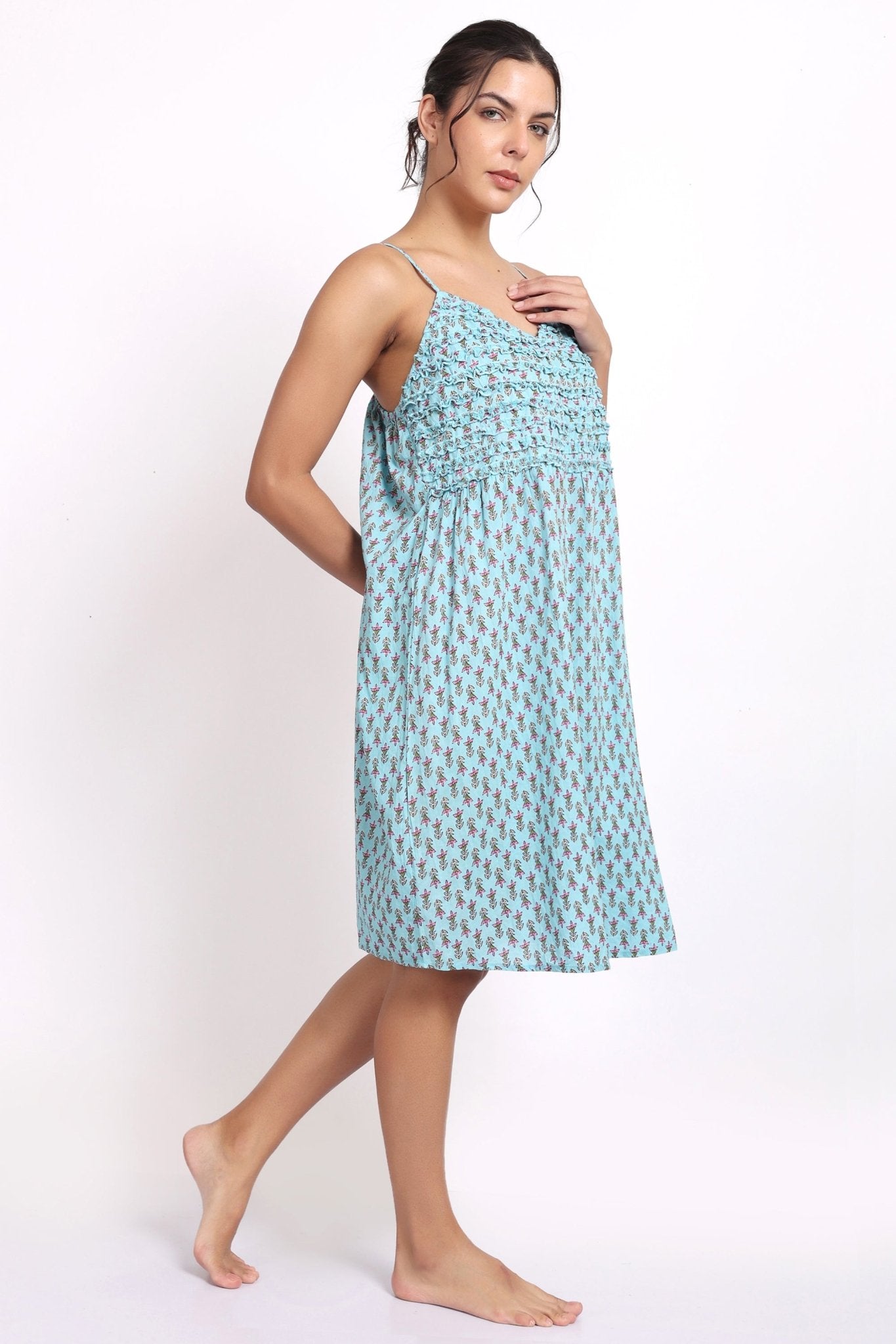 Side view of Bloom cotton nightie in aqua floral print, showing flowy fabric and relaxed summer fit.