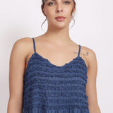 Detail of crochet frill neckline and pin tuck finish on navy self-stripe cotton.