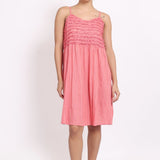 Model wearing coral self-stripe frilly nightie with spaghetti straps, front view.