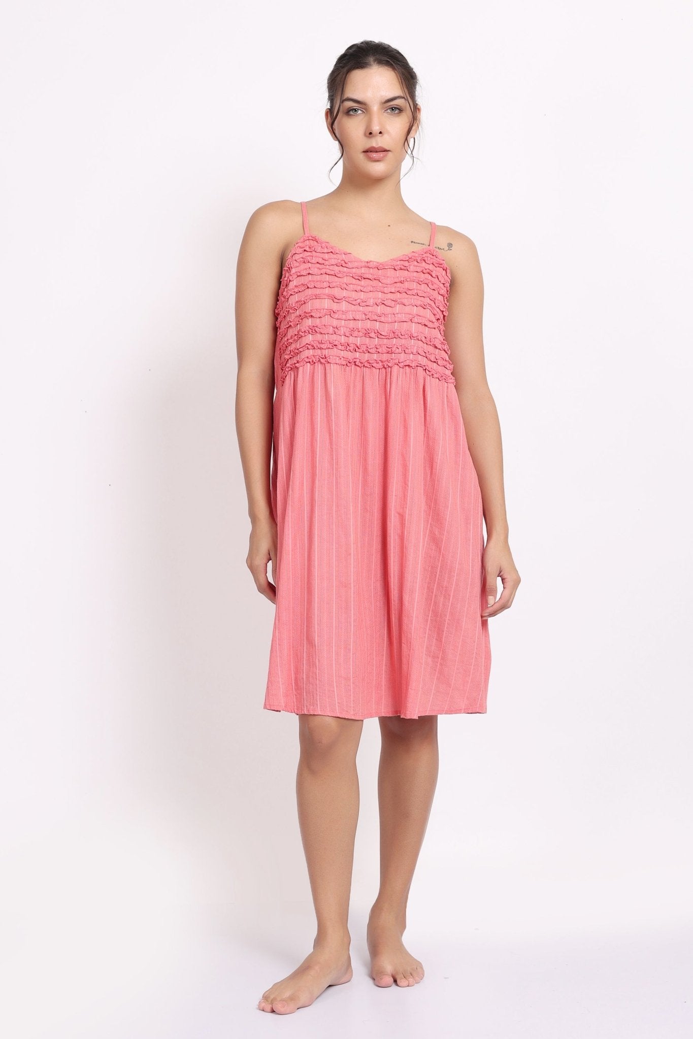 Model wearing coral self-stripe frilly nightie with spaghetti straps, front view.