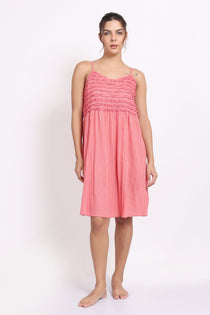 Model wearing coral self-stripe frilly nightie with spaghetti straps, front view.