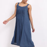 Back view of the ocean blue strappy cotton nightie with soft stripe texture and relaxed fit.