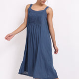 Back view of the ocean blue strappy cotton nightie with soft stripe texture and relaxed fit.