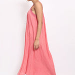 Side view of coral summer sleepdress with flowing hem and lightweight texture.