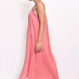 Side view of coral summer sleepdress with flowing hem and lightweight texture.
