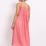Back view of strappy nightie showing elastic back and coral fabric texture.