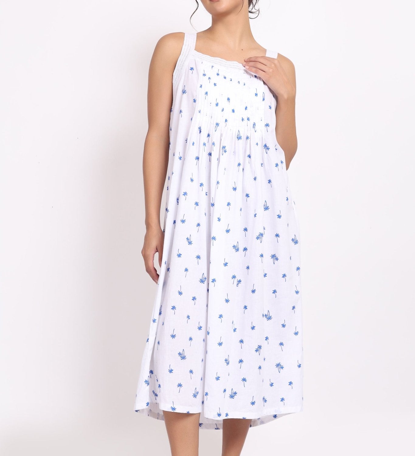 Model wearing Palm Print Strappy Nightie in navy palm print a breathable cotton nightie with pleated bust.