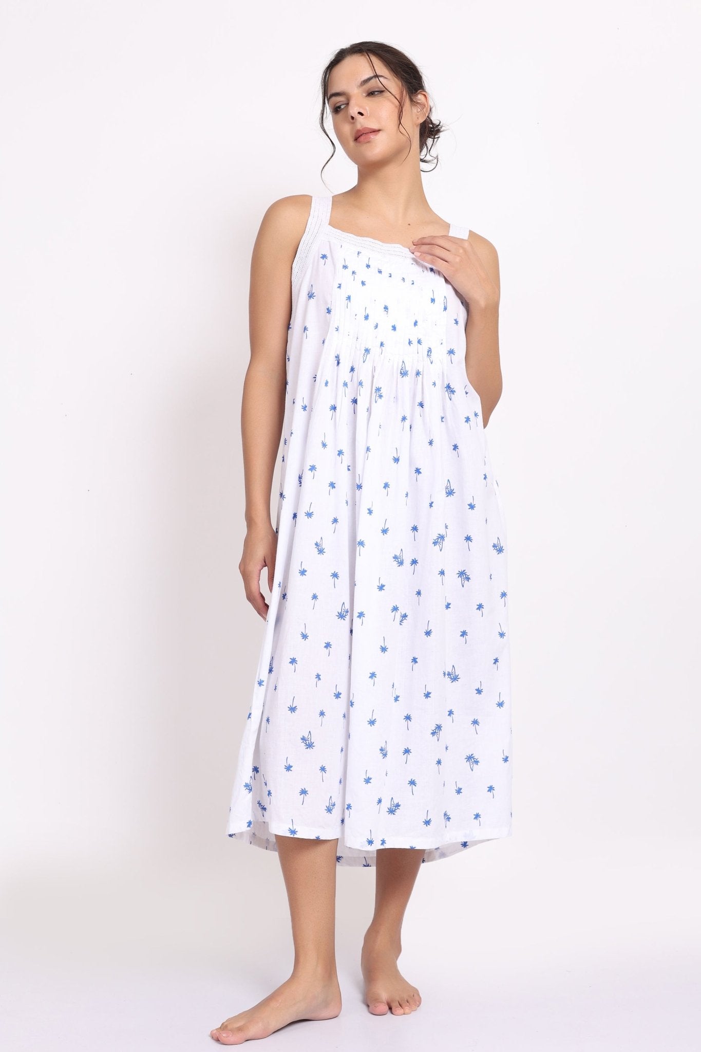 Model wearing Palm Print Strappy Nightie in navy palm print a breathable cotton nightie with pleated bust.