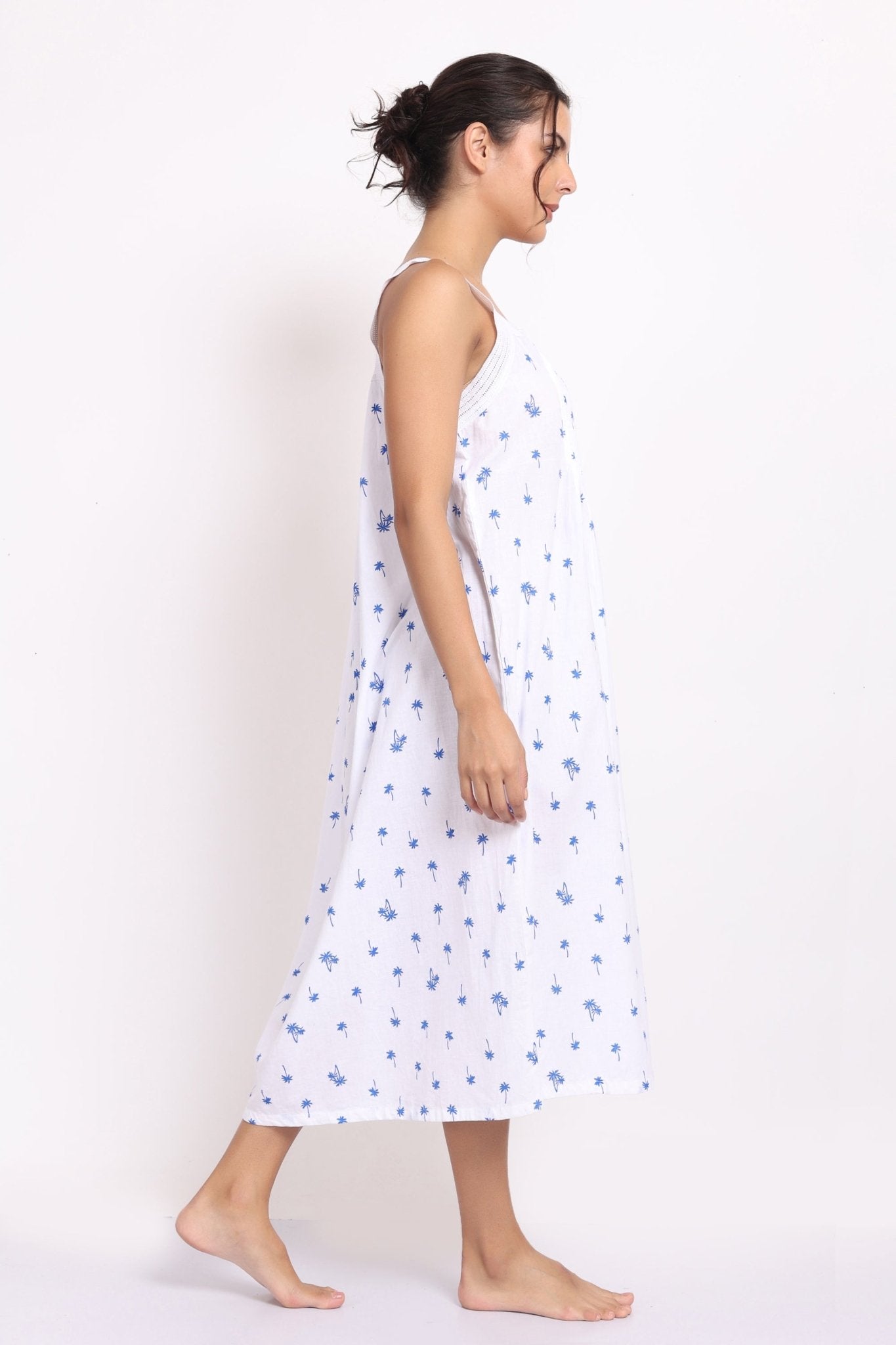 Side angle of Lotus by cotton strappy nightie showing soft drape and flowy fit with subtle pleating.