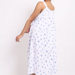 Playful twirl showcasing the lightness and movement of the navy palm print strappy nightie Back view.