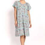 Front view Model wearing aqua floral cotton nightie with cap sleeves and mid-length hem.