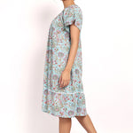 Side view of Bloom nightie highlighting flutter sleeves and knee-length cut.