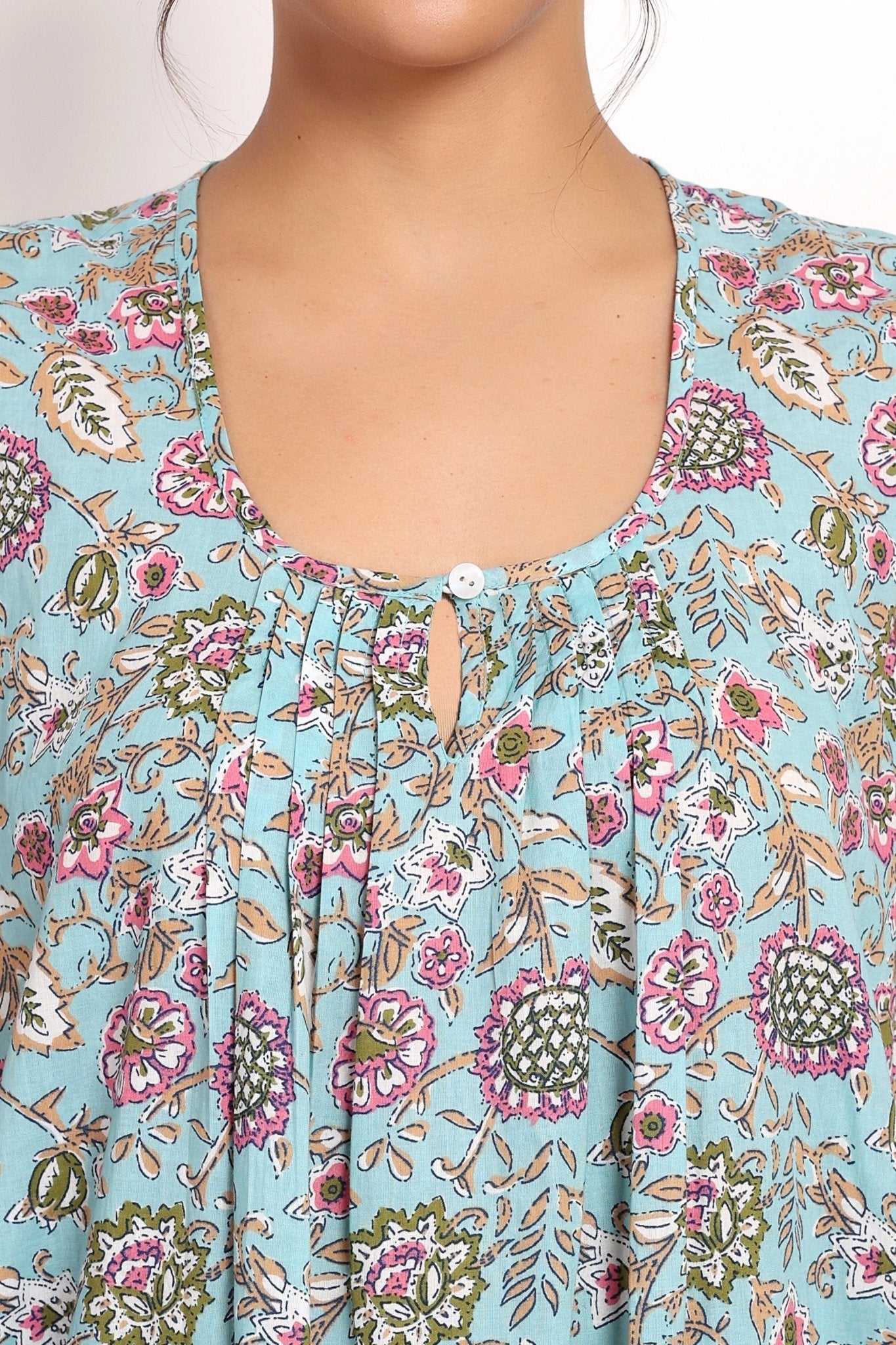 Close-up of the Bloom Nightie neckline showing gathered fabric and single-button front.