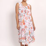 Model wearing sleeveless coral print nightie with gathered neckline and relaxed fit.