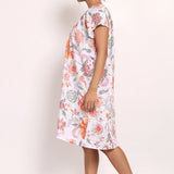 Side view of model walking in loose-fitting floral nightie, perfect for summer comfort.