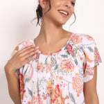 Smiling model in Passionflower nightie showing upper fit and light fabric texture.