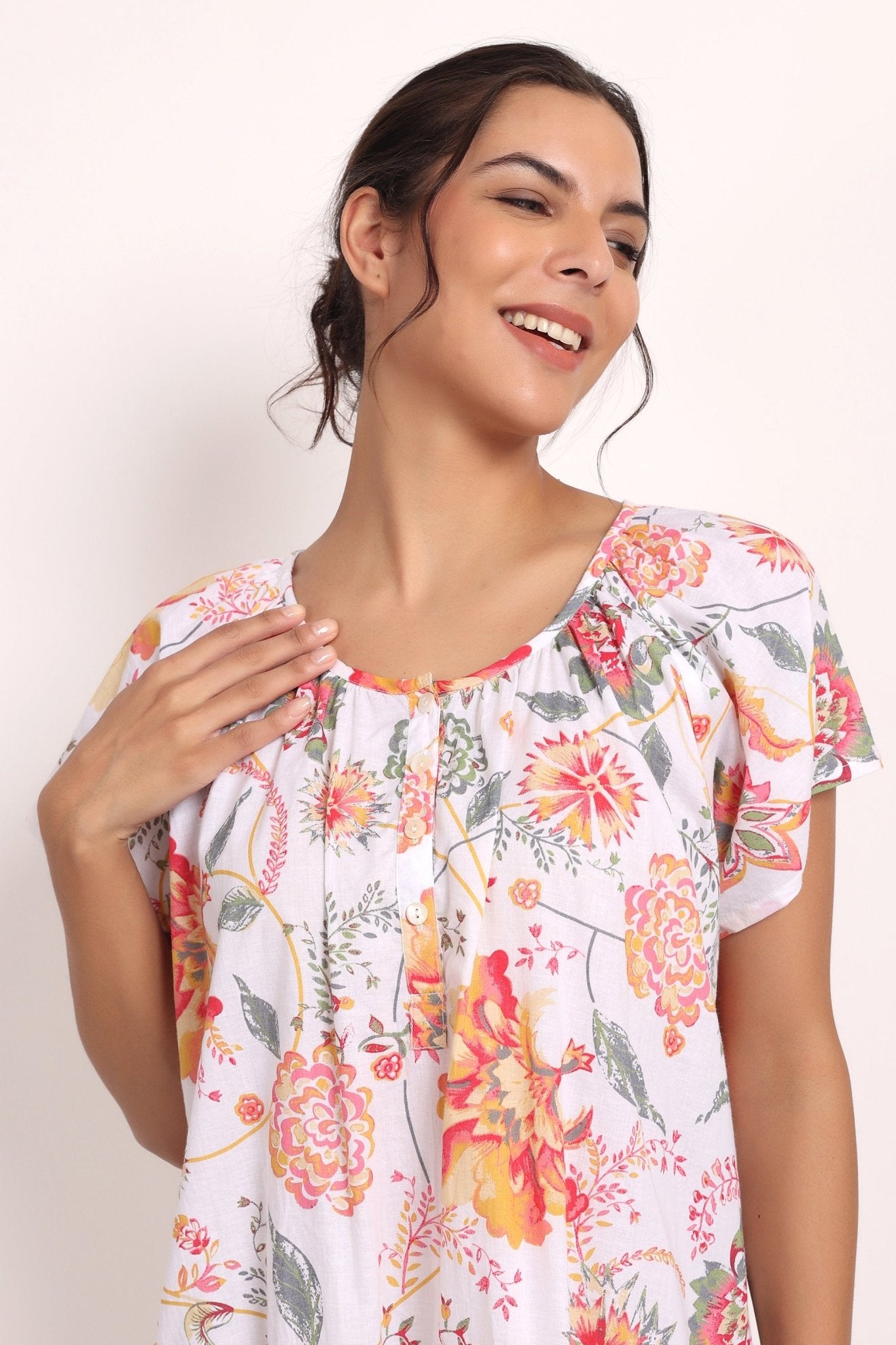 Smiling model in Passionflower nightie showing upper fit and light fabric texture.