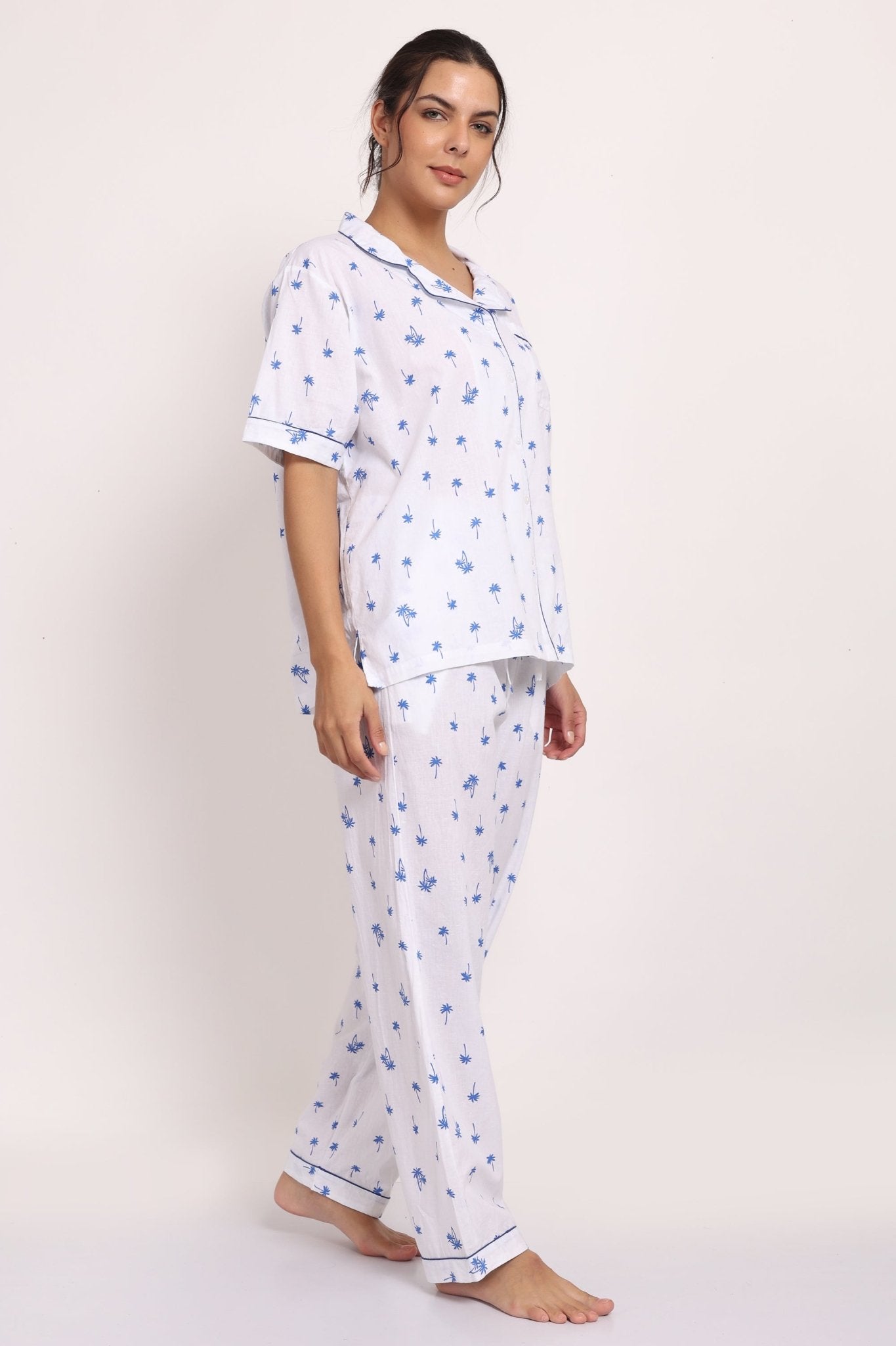 Side walking pose showing the relaxed fit and light drape of the Hamptons cotton pyjama set.
