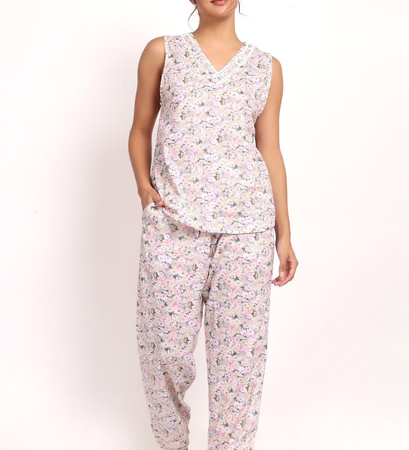 Model wearing Gatsby V-neck sleeveless cotton pyjama set in sage pink floral, front view.