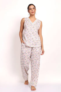 Model wearing Gatsby V-neck sleeveless cotton pyjama set in sage pink floral, front view.