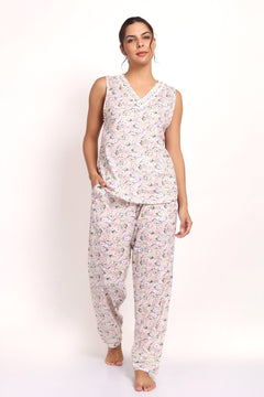 Model wearing Gatsby V-neck sleeveless cotton pyjama set in sage pink floral, front view.