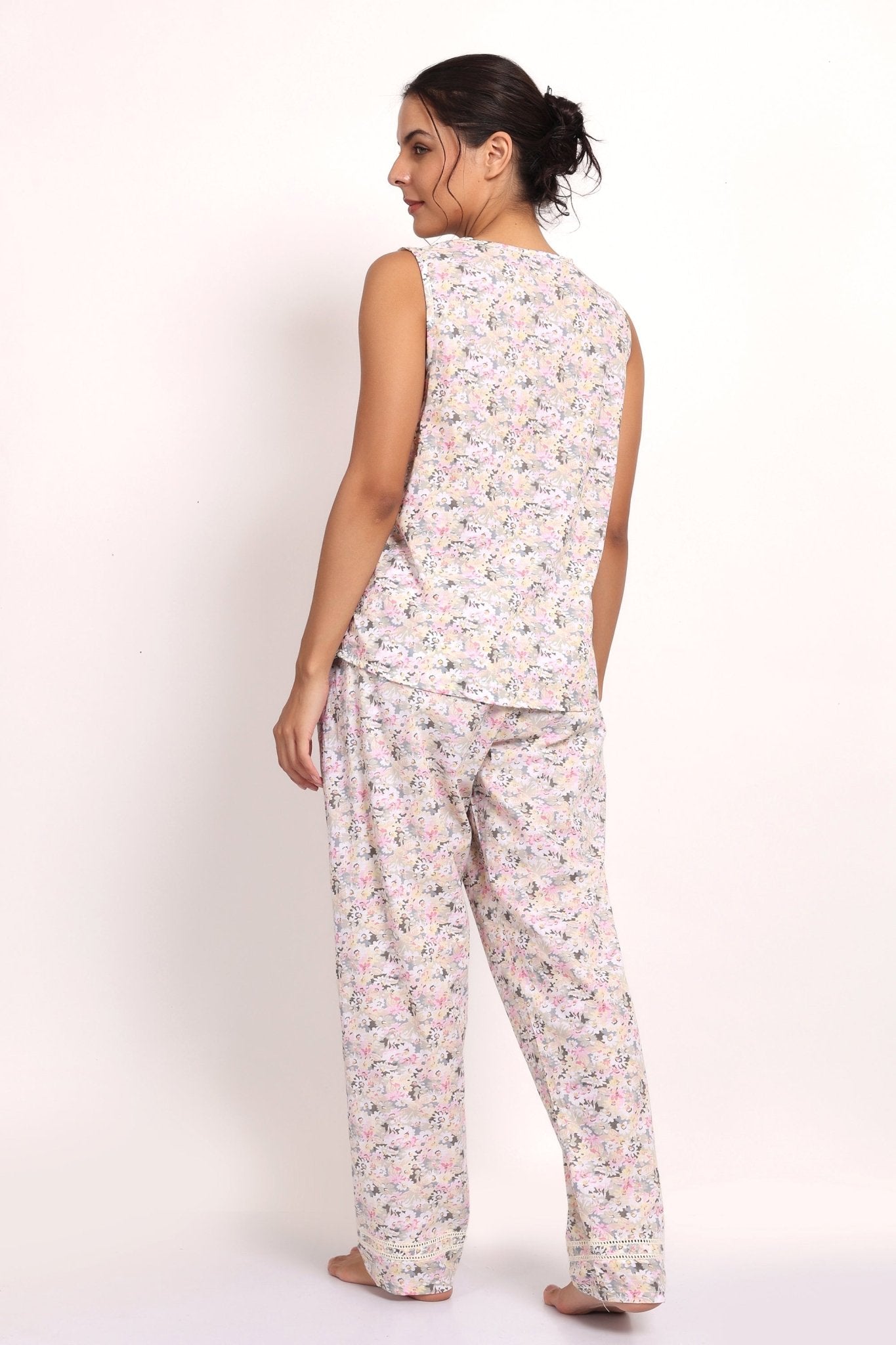 Back view of Model mid-step in Gatsby sleeveless PJ set—lightweight, breathable cotton sleepwear