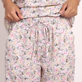 Detail of elastic waistband and ladder lace hem on Gatsby floral cotton PJ pants.