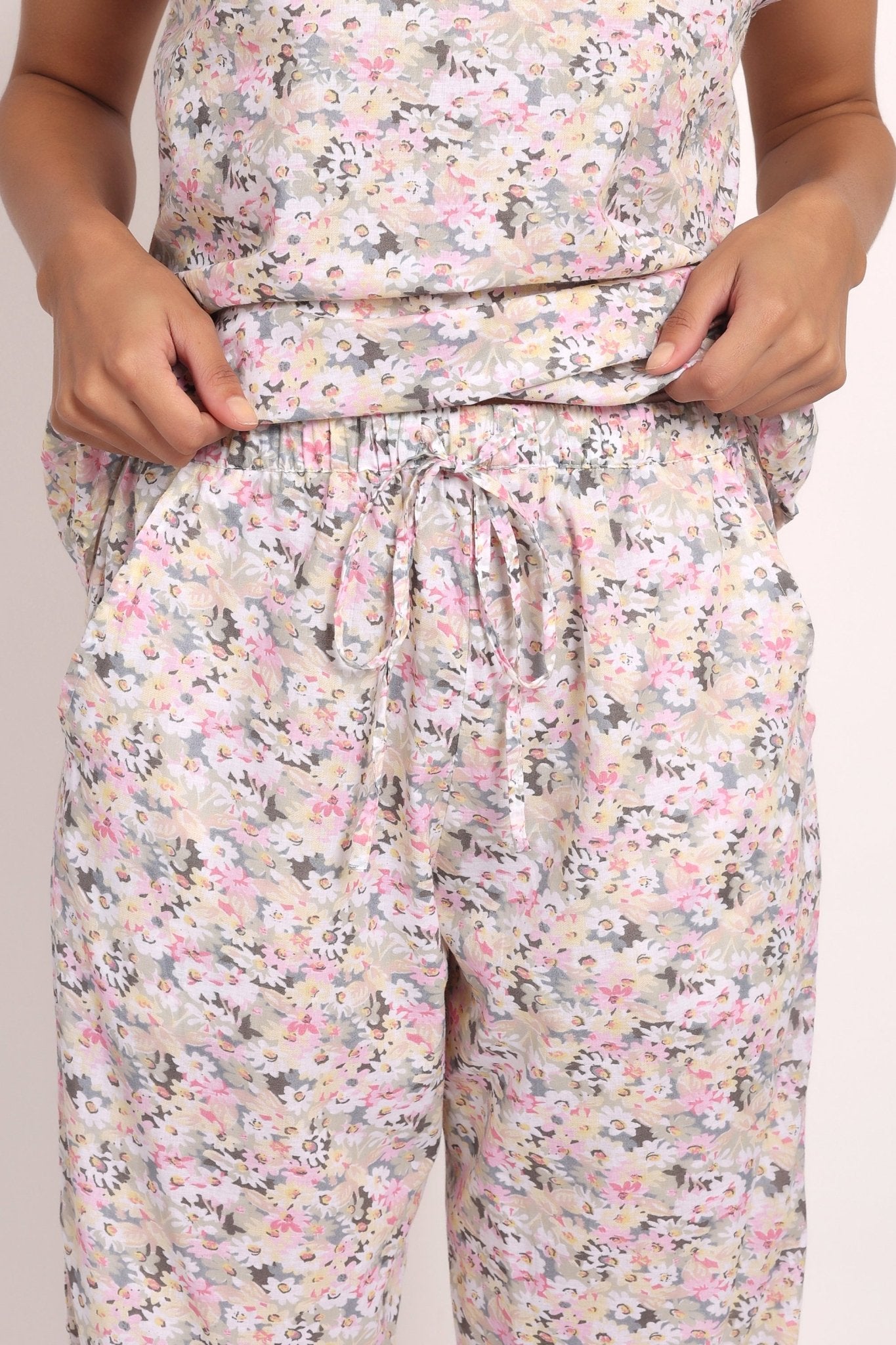Detail of elastic waistband and ladder lace hem on Gatsby floral cotton PJ pants.