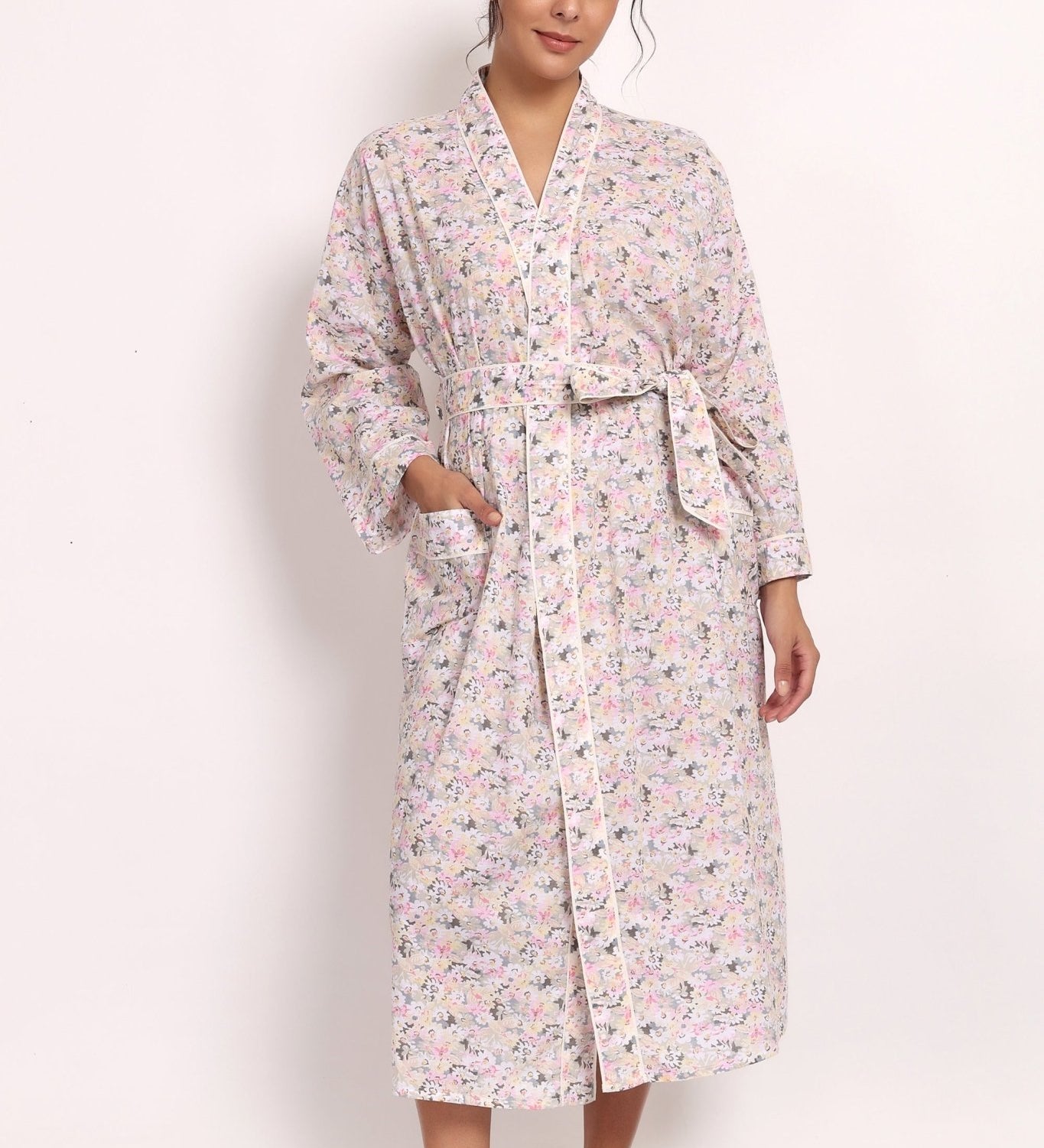 Front view of Model wearing the Gatsby cotton robe in sage pink floral print, front view tied at the waist.