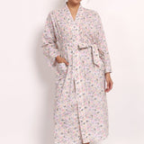 Front view of Model wearing the Gatsby cotton robe in sage pink floral print, front view tied at the waist.