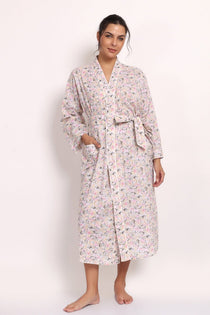 Front view of Model wearing the Gatsby cotton robe in sage pink floral print, front view tied at the waist.