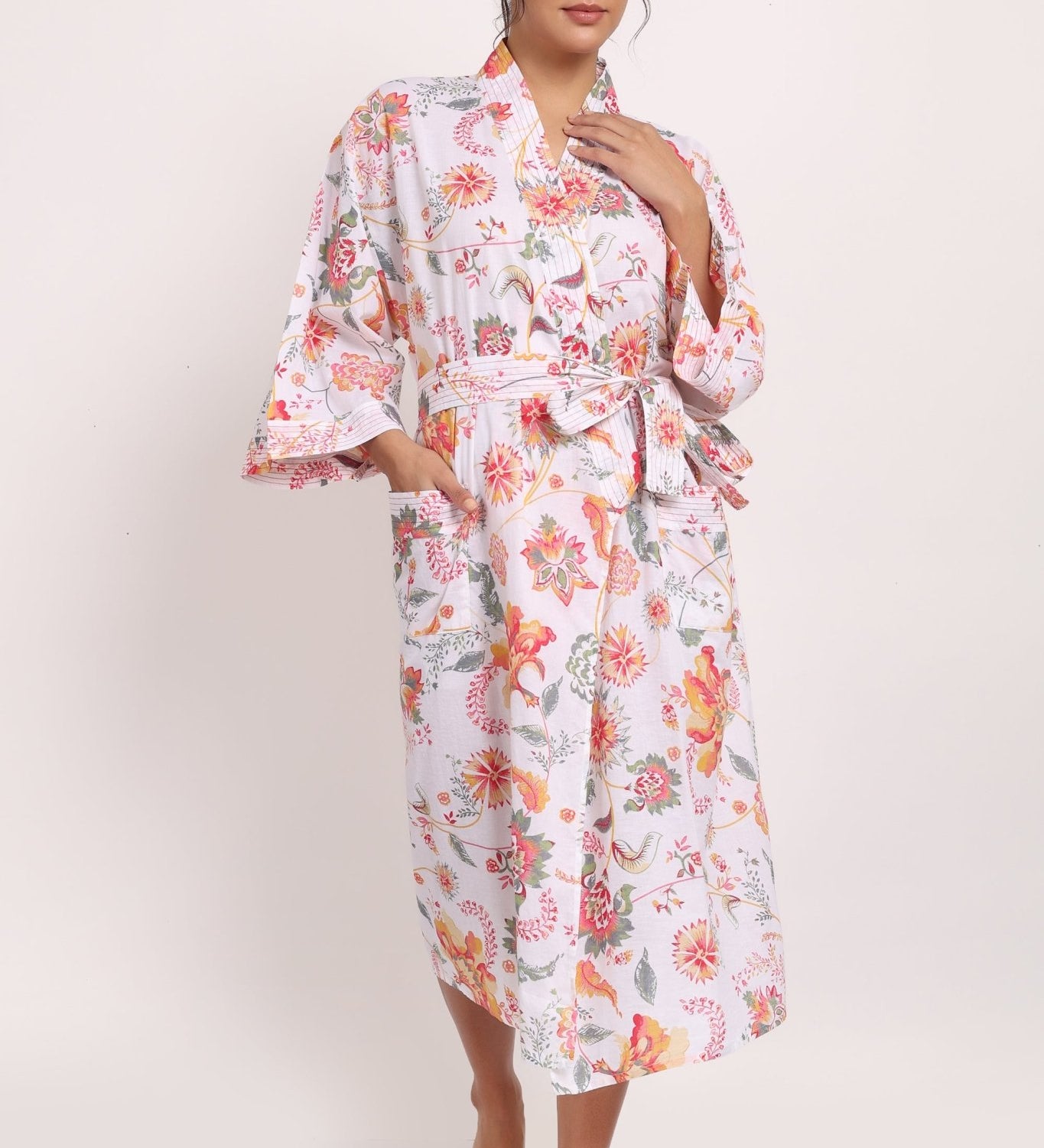 Full-length view of Passionflower Kimono in cotton coral botanical print, perfect for summer lounging.