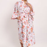 Full-length view of Passionflower Kimono in cotton coral botanical print, perfect for summer lounging.