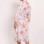 Back view of Passionflower Robe in coral print, highlighting soft drape and botanical design.