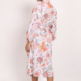 Back view of Passionflower Robe in coral print, highlighting soft drape and botanical design.
