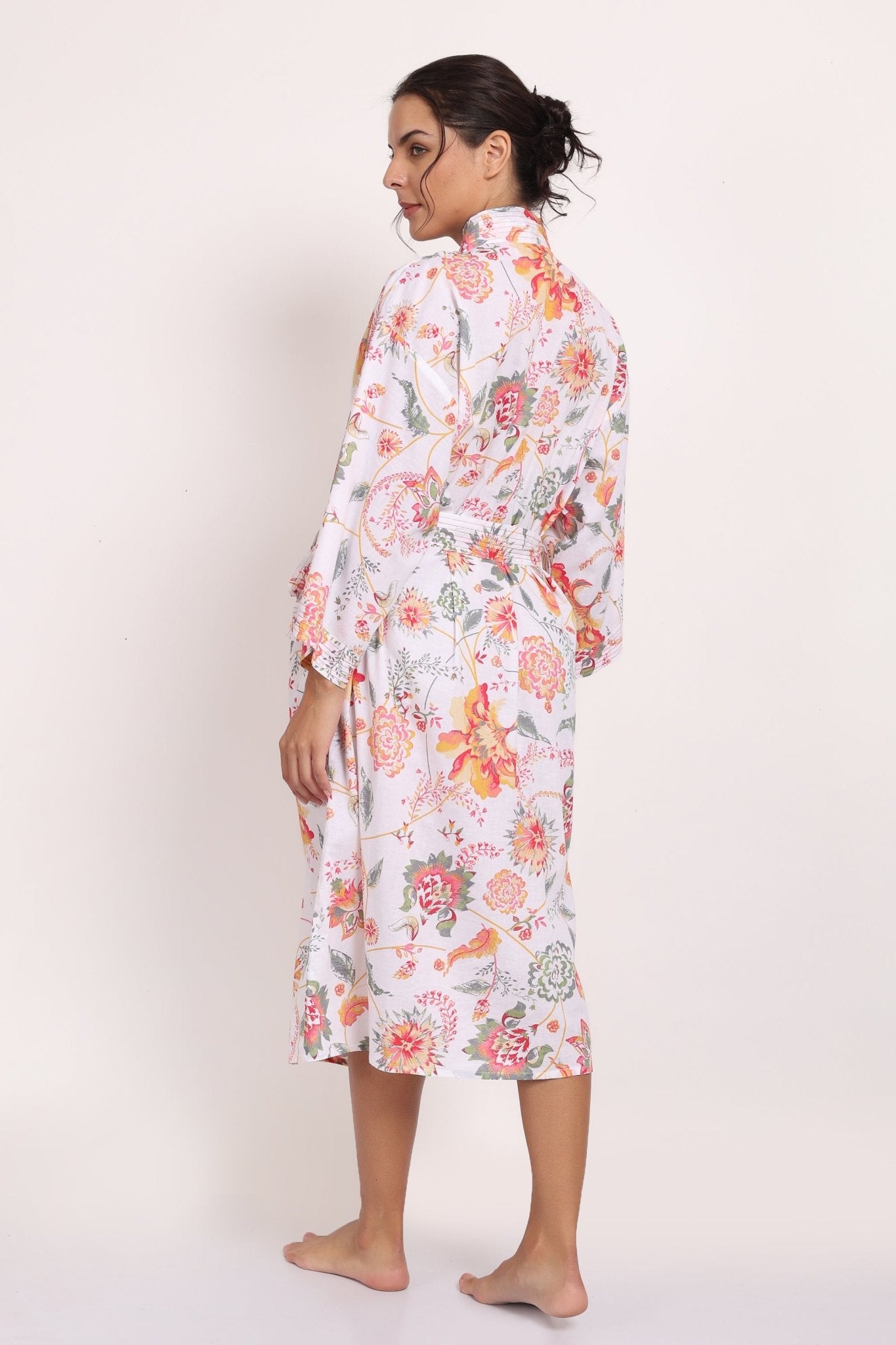 Back view of Passionflower Robe in coral print, highlighting soft drape and botanical design.