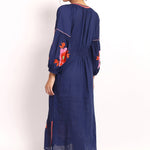 Back view of navy embroidered summer dress with elasticized panel.