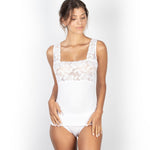 Woman wearing EGI white modal lace tank top, showing lace detail across bust and shoulder straps.