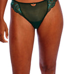 Model wearing Freya Loveland Brief Deep Emerald, green floral lace with keyhole and gemstone detail, seamless bikini brief.