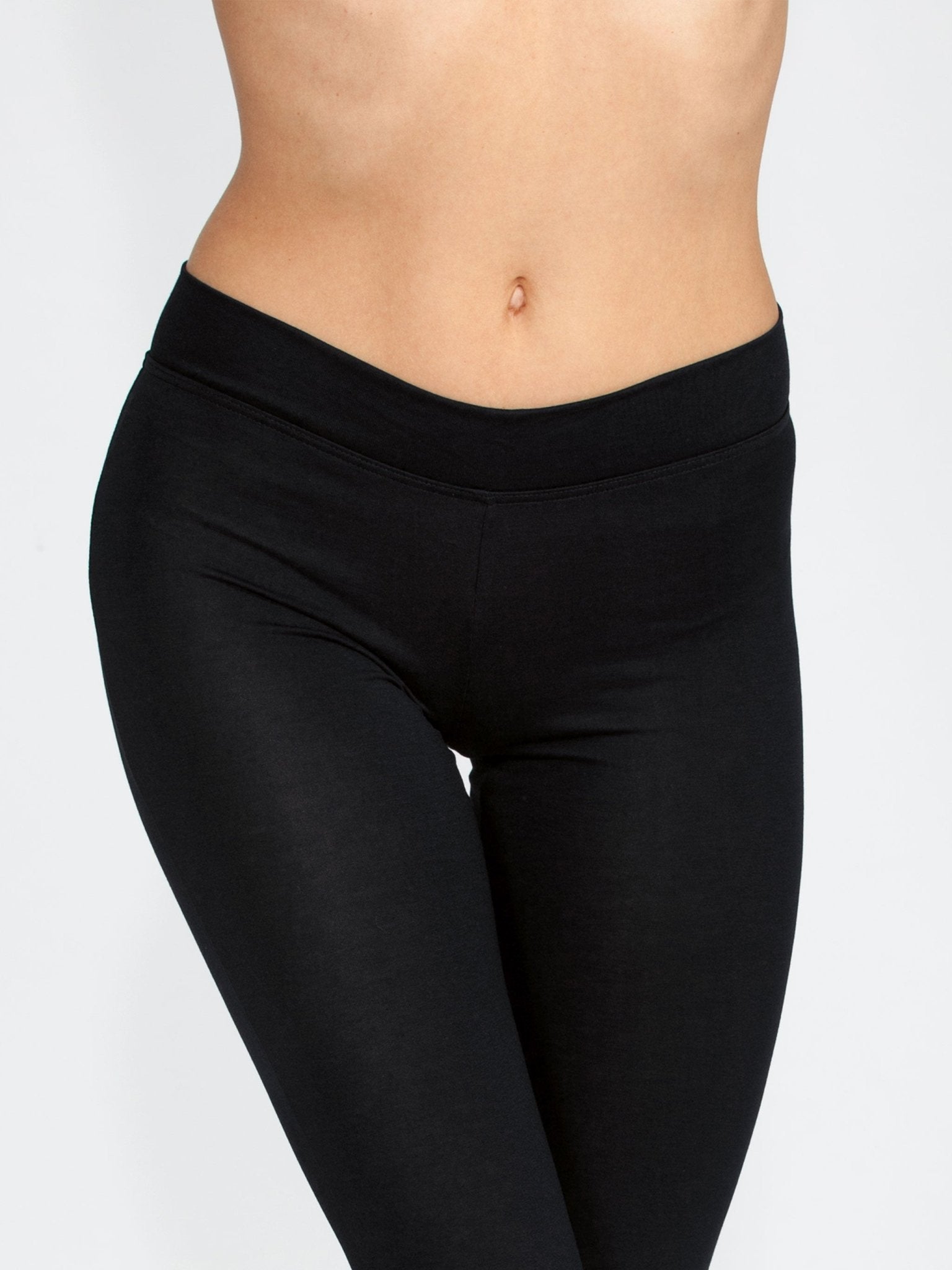 Waist-down close-up of Viscose Modal Legging in black, highlighting smooth waistband and soft viscose fabric.