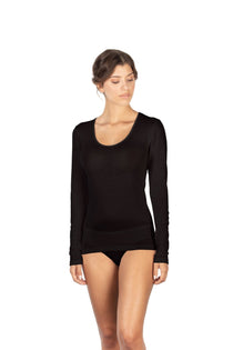 Woman wearing black long sleeve EGI top made from wool and silk with scoop neck and ribbed finish.