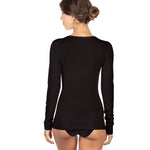 Back view of black wool and silk EGI layering top, showing long sleeves, scoop neck, and snug ribbed fit.