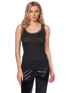 Model wearing Wool & Silk Lace Trimmed Camisole in black, featuring ribbed fabric, delicate straps, and elegant lace neckline.
